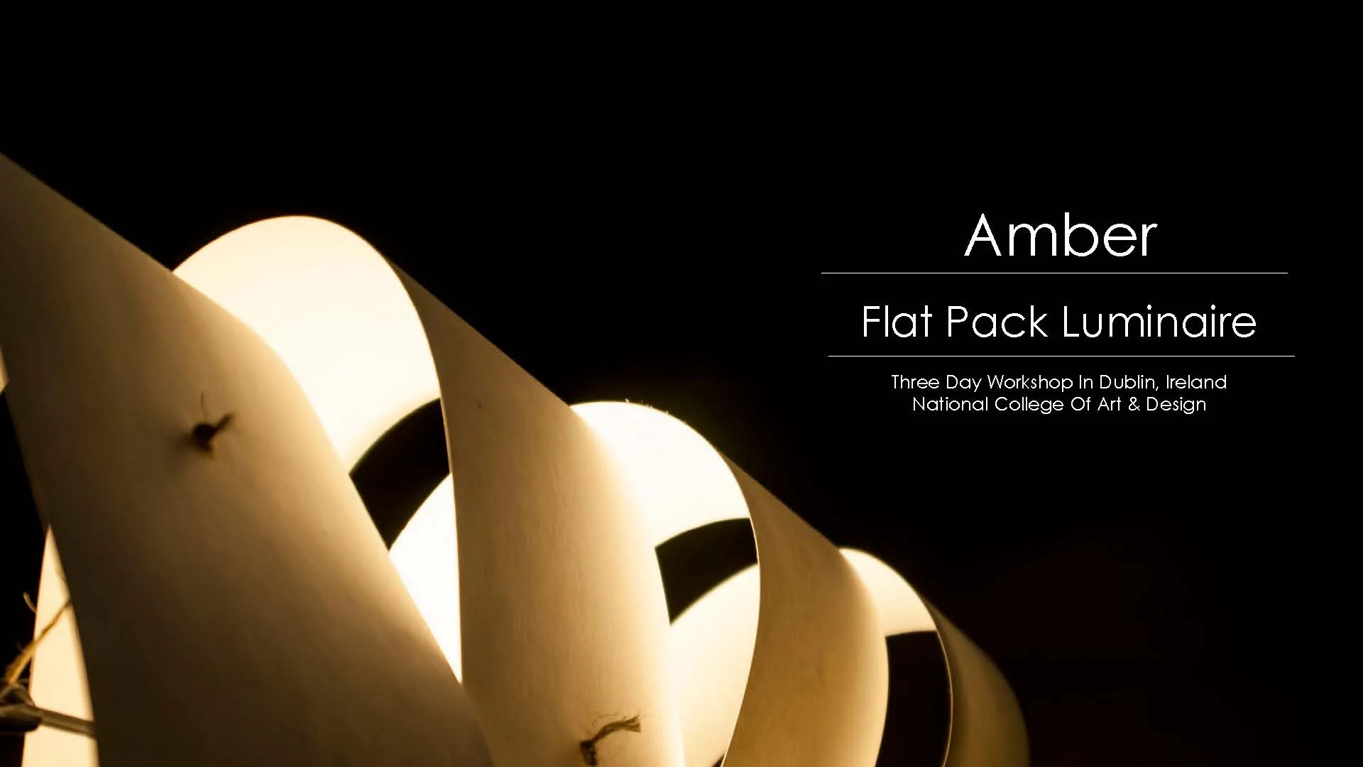 Amber luminaire lit from within, title slide reading Amber, Flat Pack Luminaire, Three Day Workshop in Dublin, Ireland, National College of Art & Design